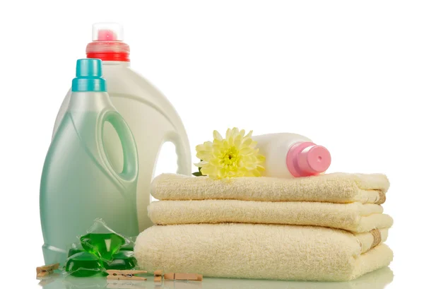 Detergent in bottles and towels — Stock Photo, Image