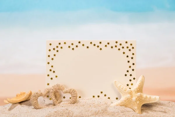 Blank card in sand — Stock Photo, Image