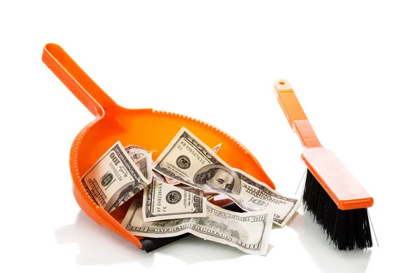 Sweeps money in the scoop — Stock Photo, Image