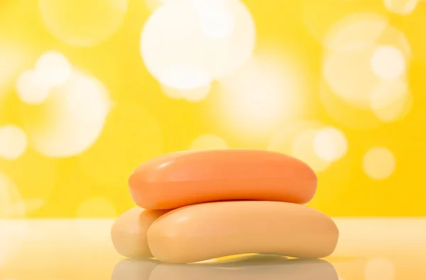 Soap bars on yellow background — 图库照片