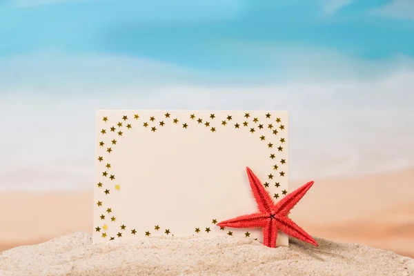 Blank card in sand — Stock Photo, Image