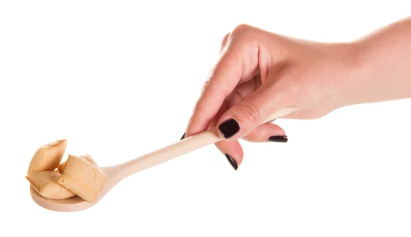 Hand with spoon and breakfast flakes — Stockfoto