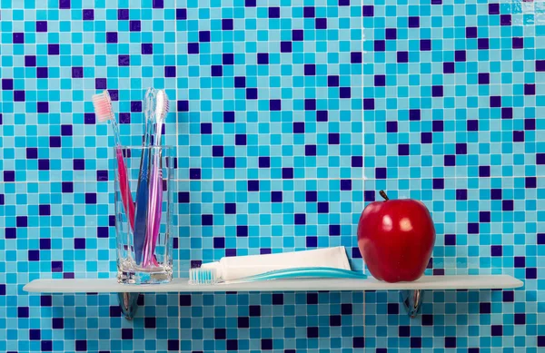 Red apple with toothpaste and brush — Stock Photo, Image