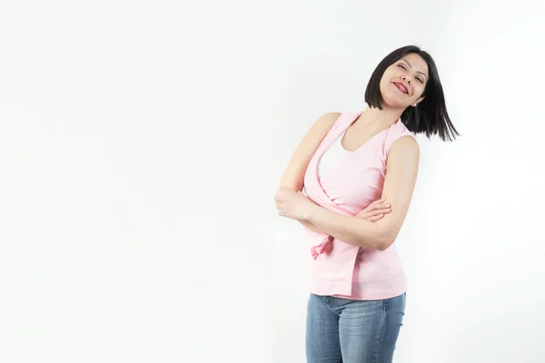 Una Donna Con Una Shirt Rosa Jeans Posa Uno Studio — Foto Stock