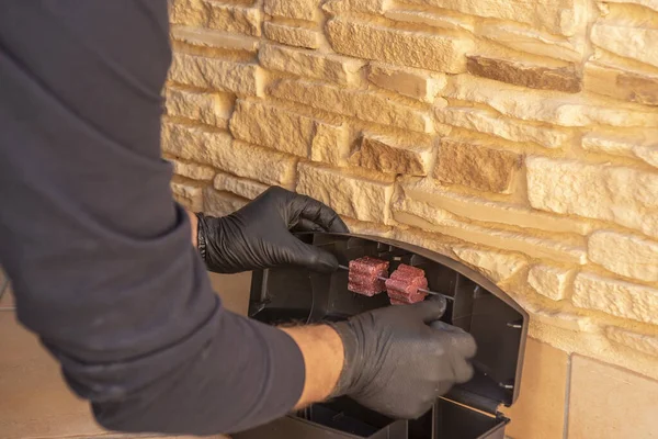 A closeup shot of a professional preparing a trap for rats, mice - pest control concept