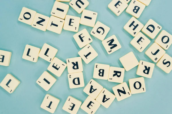 Top View Alphabet Letters Wooden Pieces Blue Surface — Stockfoto