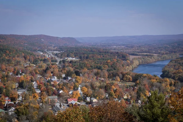 An aerial view of the beautiful cityscape of Iron Mountain, Michigan with trees wearing autumn colors