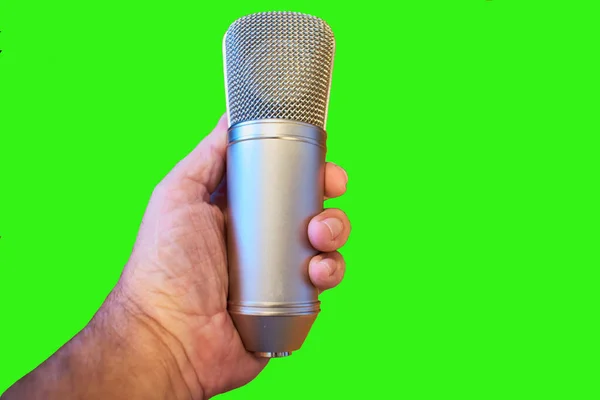 Isolated Closeup Man Hand Holding Condenser Microphone Green Background — Stock Photo, Image