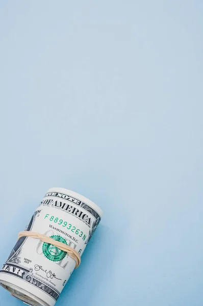 Vertical Shot Bundle Rolled American Banknotes Light Blue Background — Stock Photo, Image