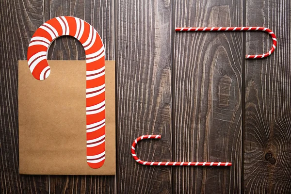 Closeup Candy Canes Paper Bag Wooden Background — Stock Photo, Image