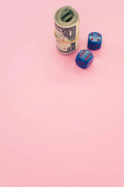 Vertical Shot Rolled Dollar Bills Dices Pink Surface — Stock Photo, Image