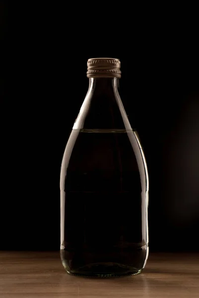 Transparent Glass Bottle Filled Water Dark Background — Stock Photo, Image