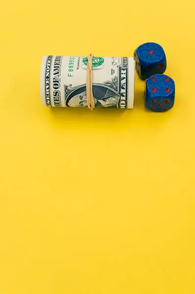 Vertical Shot Rolled Dollar Bills Dices Yellow Surface — Stock Photo, Image