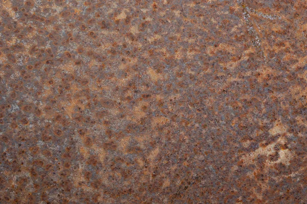 用褐色铁锈覆盖的风化表面的顶视图特写 — 图库照片