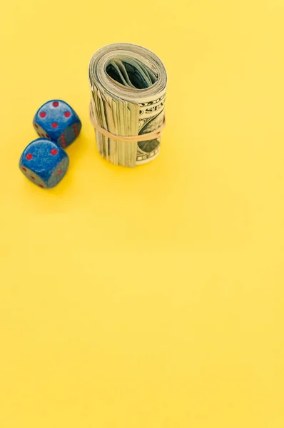 Vertical Shot Rolled Dollar Bills Dices Yellow Surface — Stock Photo, Image