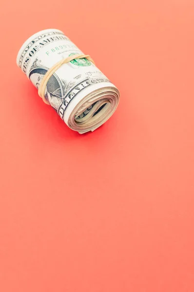 Vertical Shot Rolled Dollar Bills Red Surface — Stock Photo, Image