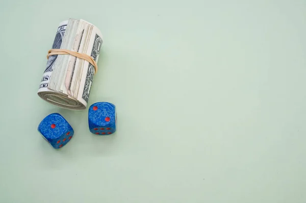 Bundle Rolled American Banknotes Two Dice Isolated Light Blue Background — Stock Photo, Image