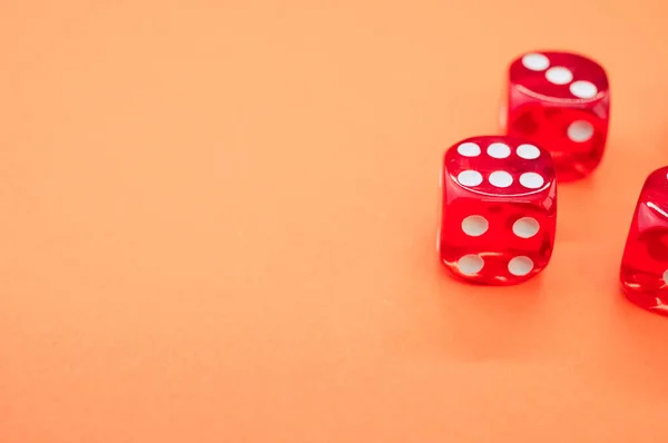 Closeup Red Rolling Dice Orange Background — Stock Photo, Image