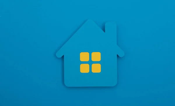Een Huis Onroerend Goed Icoon Een Blauwe Achtergrond — Stockfoto