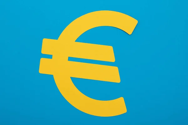 Het Gele Euro Pictogram Een Blauwe Achtergrond — Stockfoto