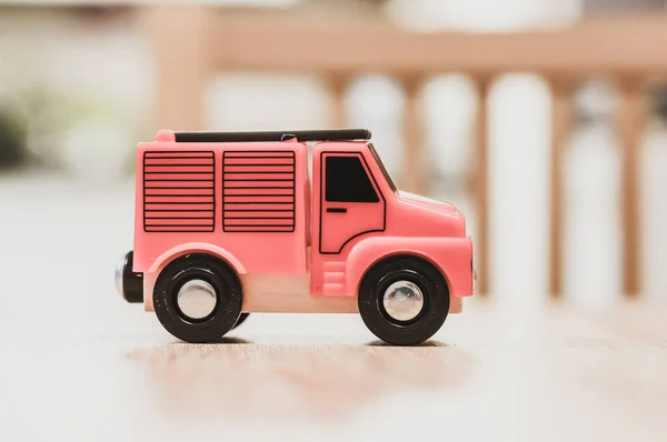 Closeup Tiny Firetruck Car Toy Placed Wooden Table Blurry Background — Stock Photo, Image