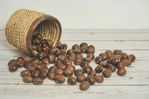 Fresh Chestnuts Basket Falling Brown Wooden Table Christmas Decorations — Stock Photo, Image