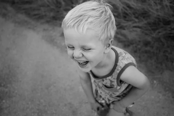 Greyscale Shot Cute Laughing Blonde Boy — Stockfoto