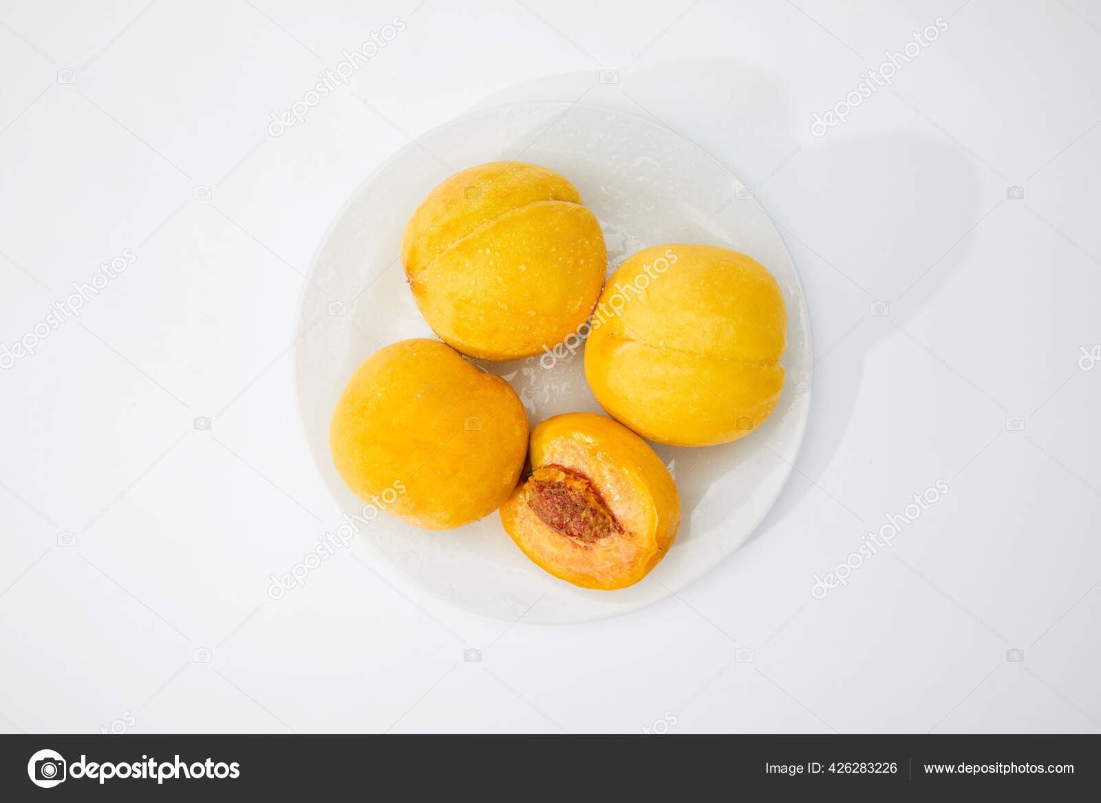 Fresh Wet Peaches White Plate Stock Photo by ©Wirestock 426283226