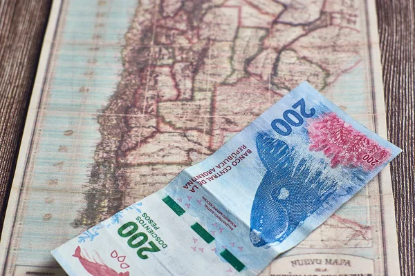 Top View Closeup 200 Argentinian Pesos Placed Ancient Map Wooden — Stock Photo, Image