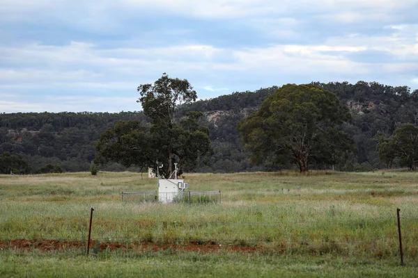 An air quality testing station in a field monitoring area near a coal mine