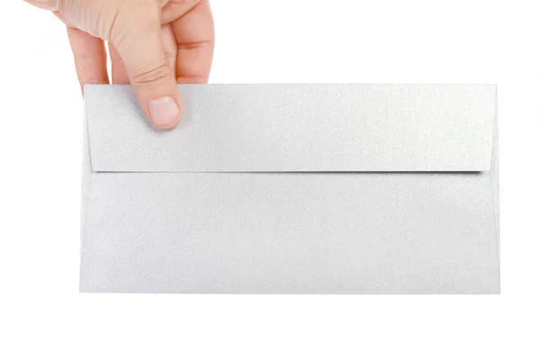 Een Hand Met Een Zilveren Envelop Een Witte Achtergrond — Stockfoto