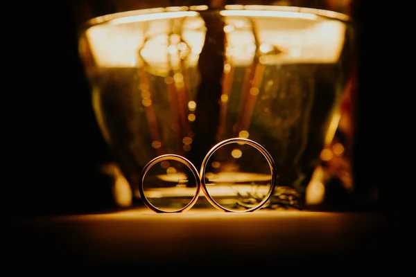 Closeup Shot Two Rings Romantic Candlelight — Stock Photo, Image