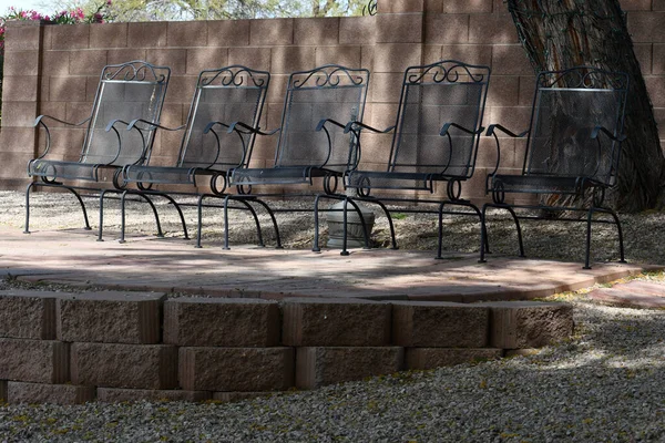 Five Black Chair Outdoor Area Partial Sunlight Stock Picture