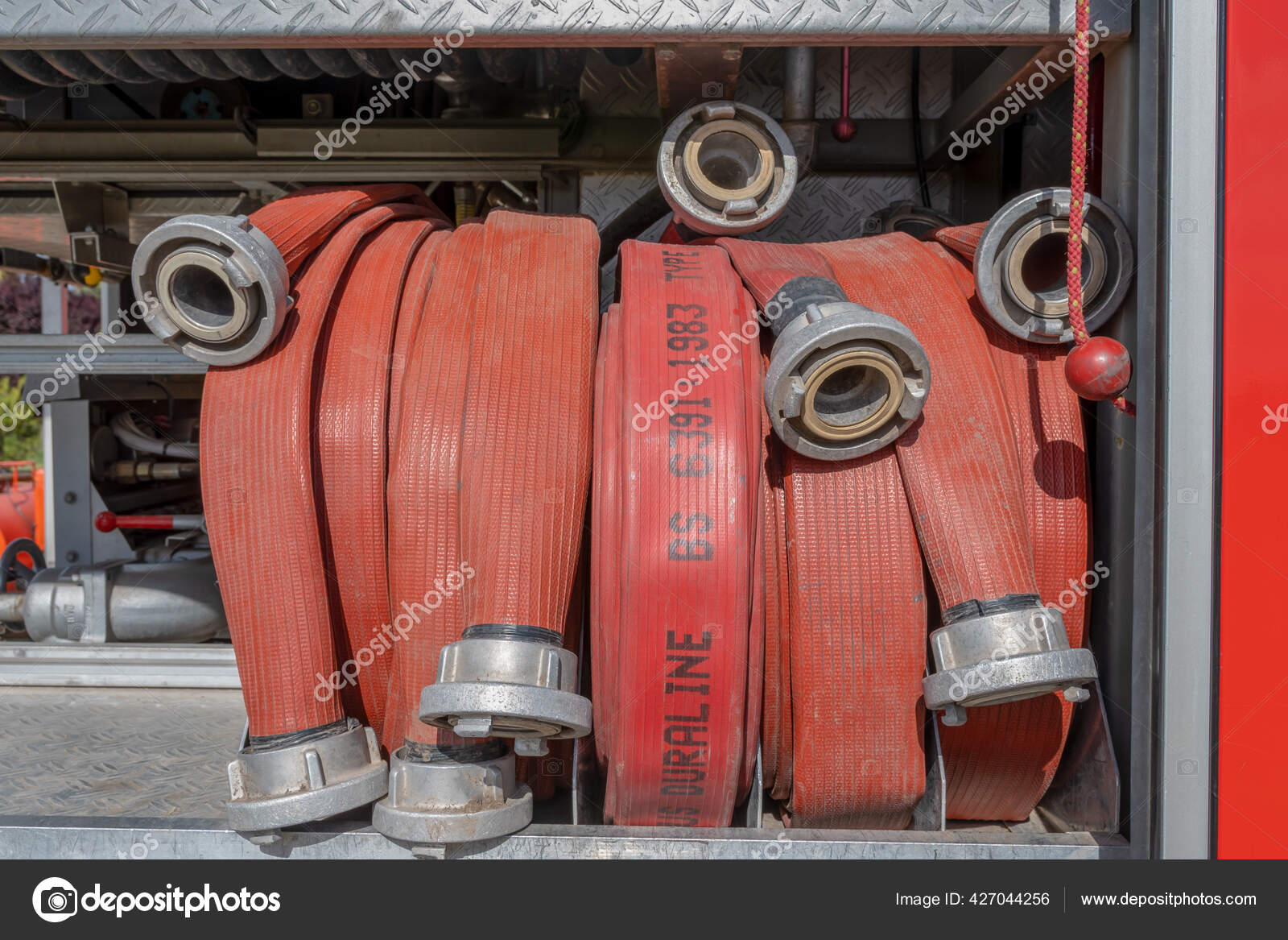 Closeup Shot Fire Hoses Truck — Stock Photo © Wirestock #427044256