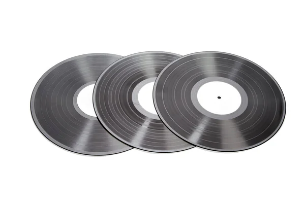 白い背景に3枚のレコードのクローズアップショット — ストック写真