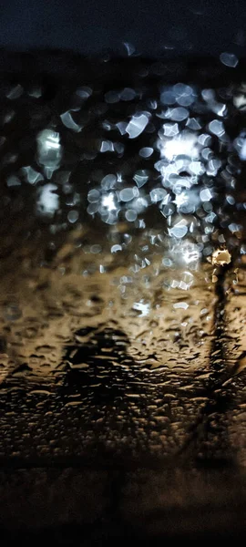 Vertical Shot Glass Window Covered Raindrops Creating Bokeh Lights Perfect — Stock Photo, Image