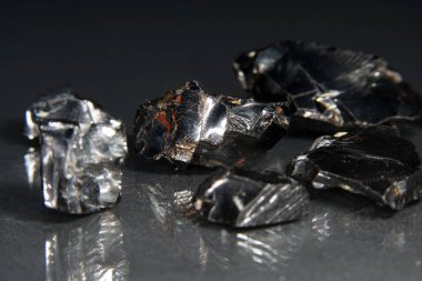 A closeup shot of fine gallium stones isolated on dark background clipart