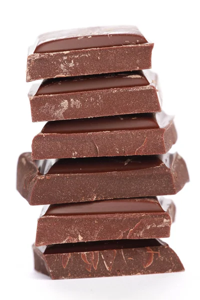 Beyaz Arka Planda Istiflenmiş Çikolataların Dikey Çekimi — Stok fotoğraf