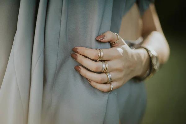 Closeup Female Brown Nail Polish Rings Standing Outdoors Crossed Arms — Stock Photo, Image