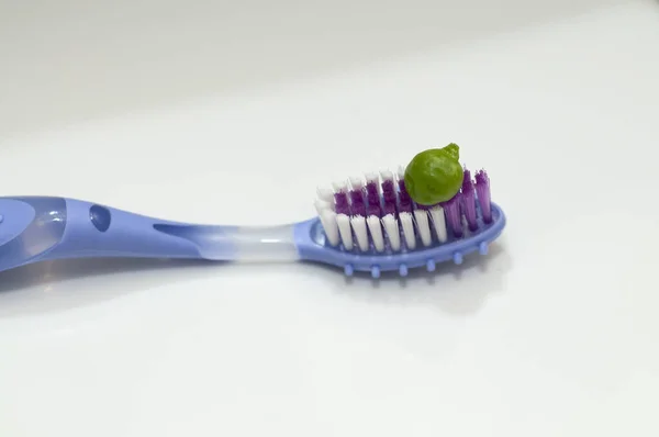 Closeup Green Toothpaste Squeezed Colorful Toothbrush White Background — Stock Photo, Image