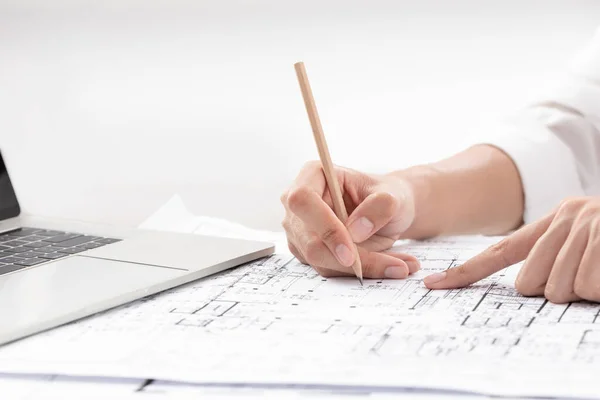 stock image A hand of businesswoman writing on paper in the office