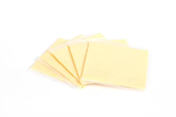 Eine Nahaufnahme Von Cheddar Käsescheiben Isoliert Auf Weißem Hintergrund — Stockfoto