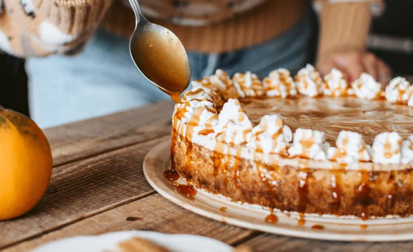 Spoon Covering Yummy Pumpkin Cheesecake Syrup — Stock Photo, Image