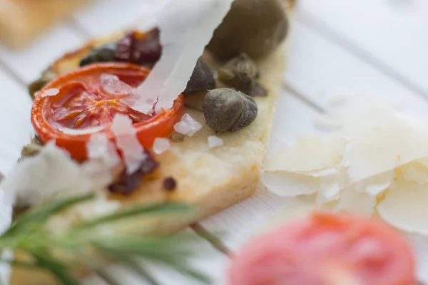 Shot Tasty Bruschetta Tomatoes Olives Capers Cheese Served Wooden Board — Stock Photo, Image