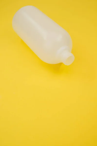 Vertical Shot Plastic Bottle Yellow Background — Stock Photo, Image