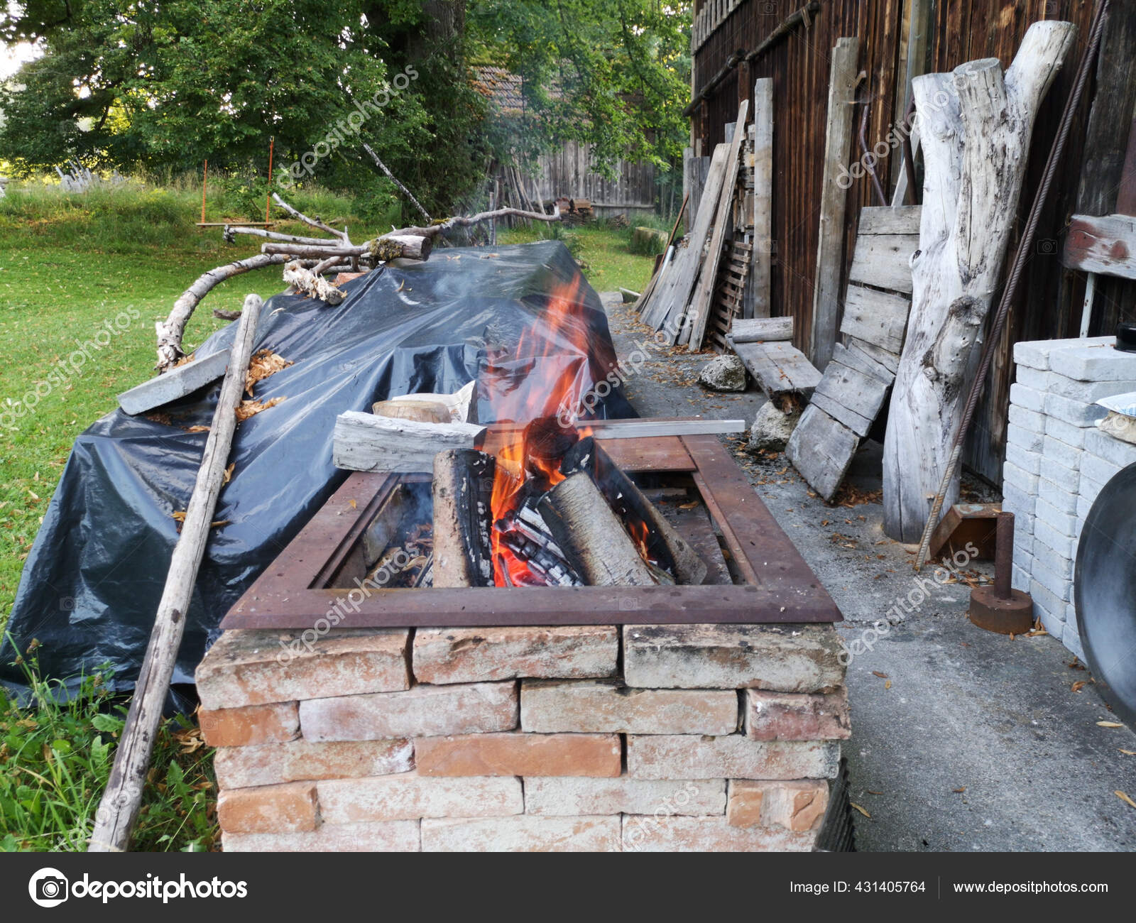Fire Burning Brick Charcoal Next Building Stock Photo by ©Wirestock