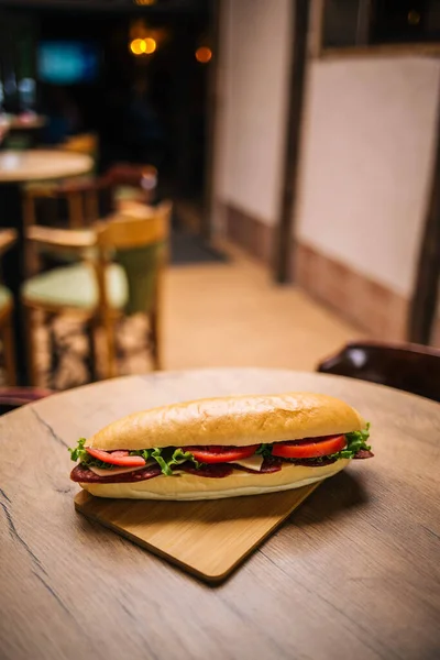 Closeup Delicious Fresh Sandwich Salami Veggies Wooden Table — Stock Photo, Image