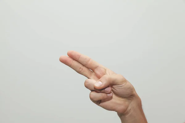 Closeup Shot Person Showing Two Fingers Gray Background — Stock Photo, Image