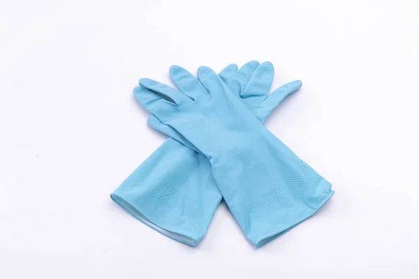 白色表面上一副蓝色清洁手套的高角镜头 — 图库照片