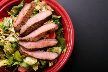 sirloin steak with summer salad, a ketogenic diet meal clipart